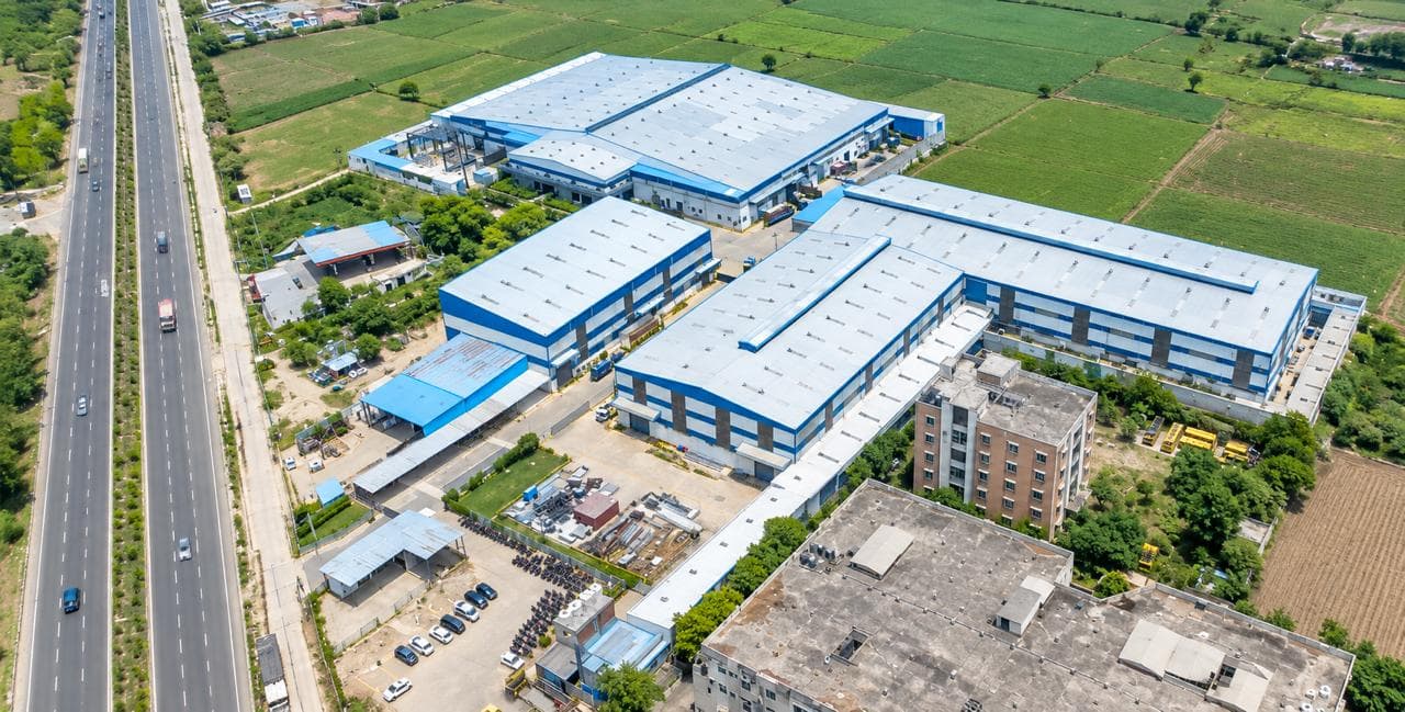 Aerial view of the Indus Appliances campus in Bahadurgarh beside the Delhi–Rohtak highway